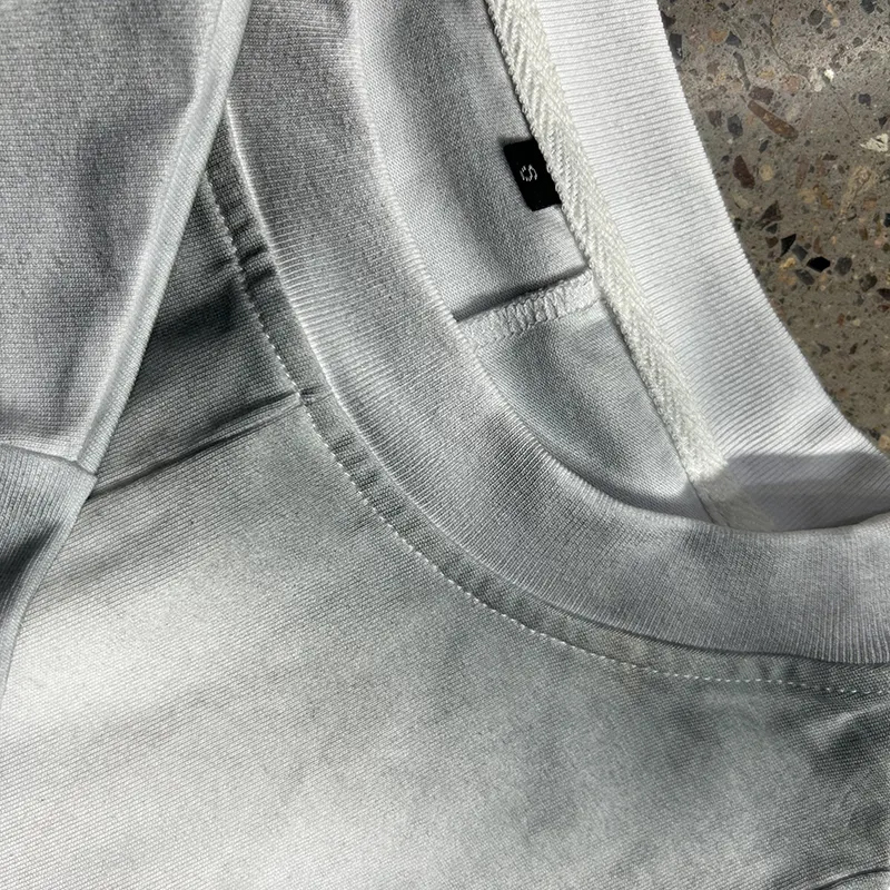 hongfeng produces mens crew neck t shirts with customized cotton splicing and unique designs.